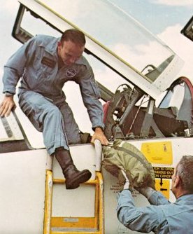 A photo of astronaut, Collins exiting out of T-38 jet