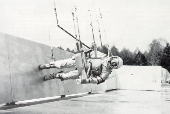 A photo of astronaut suspended in air on his side