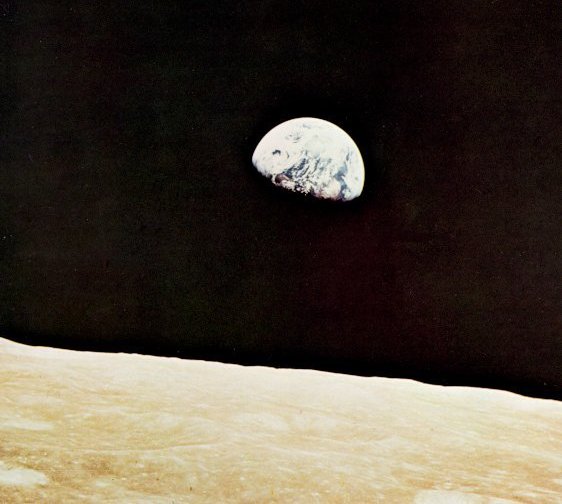 A photo of the Earth rising seen from the far side of the Moon
