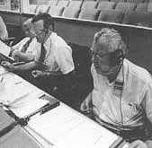 Cernan, Lunney, and Tatistcheff in the control center